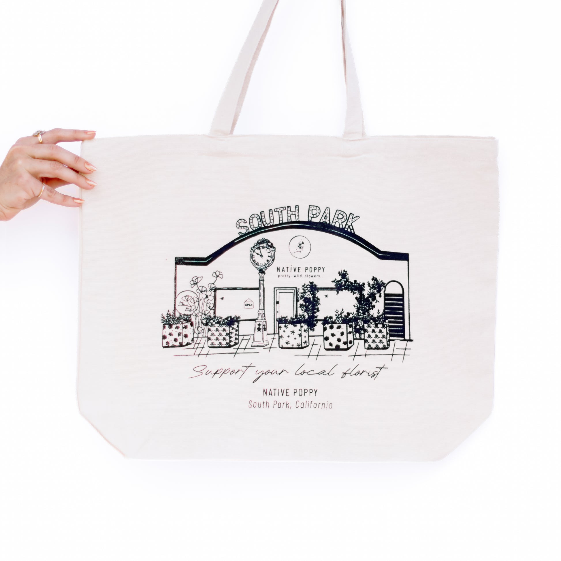 A cotton canvas tote bag that shows your love for the best lil floral shop in town. 