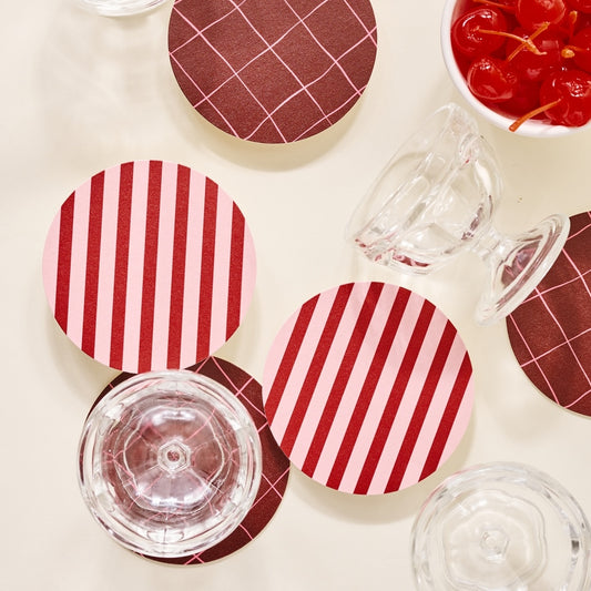 red and pink striped coasters with glasses and cherries