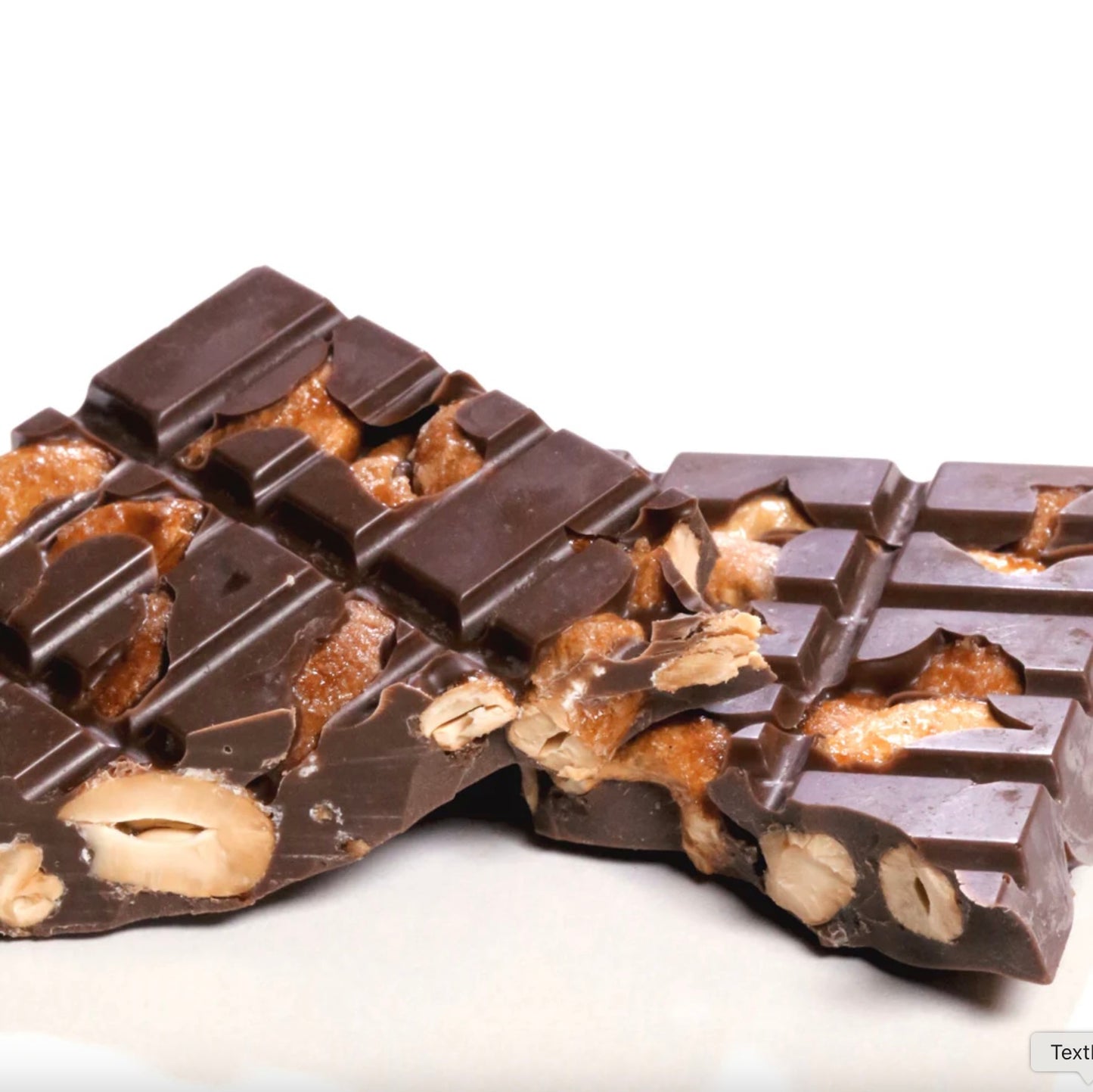 Chocolate bar with nuts on a white background