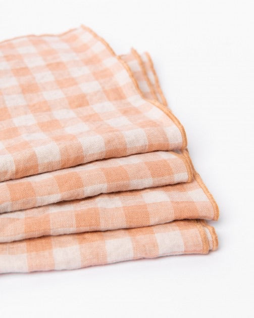 Beautiful linen napkins in Peach/Beige gingham. Napkins are outlined by a tone to tone embroidery stitch. Perfect for everyday dining and special occasions.