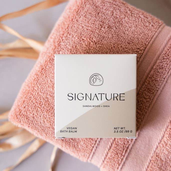 Signature bath bomb on pink towel