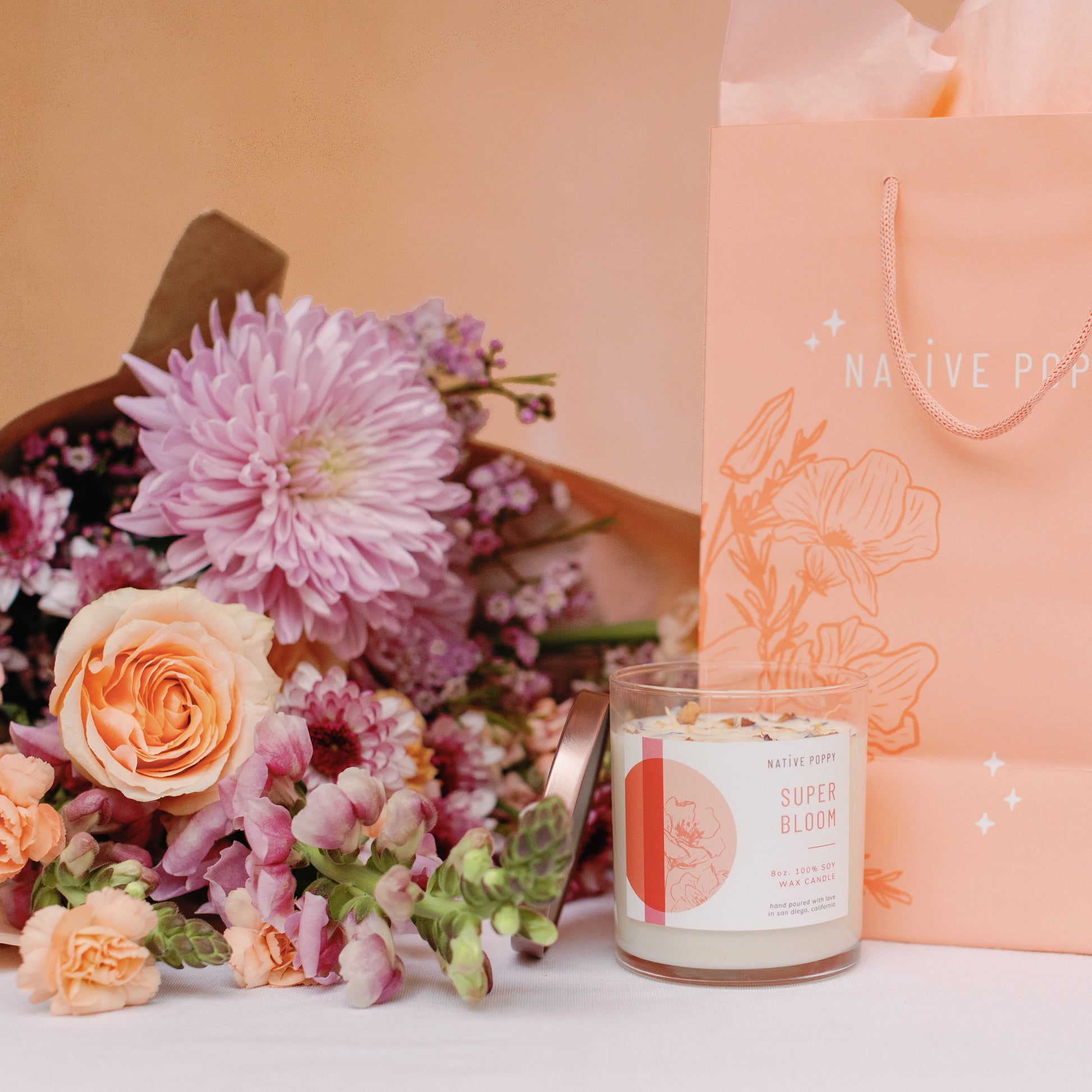 Super Bloom candle and a bouquet of flowers from Native Poppy