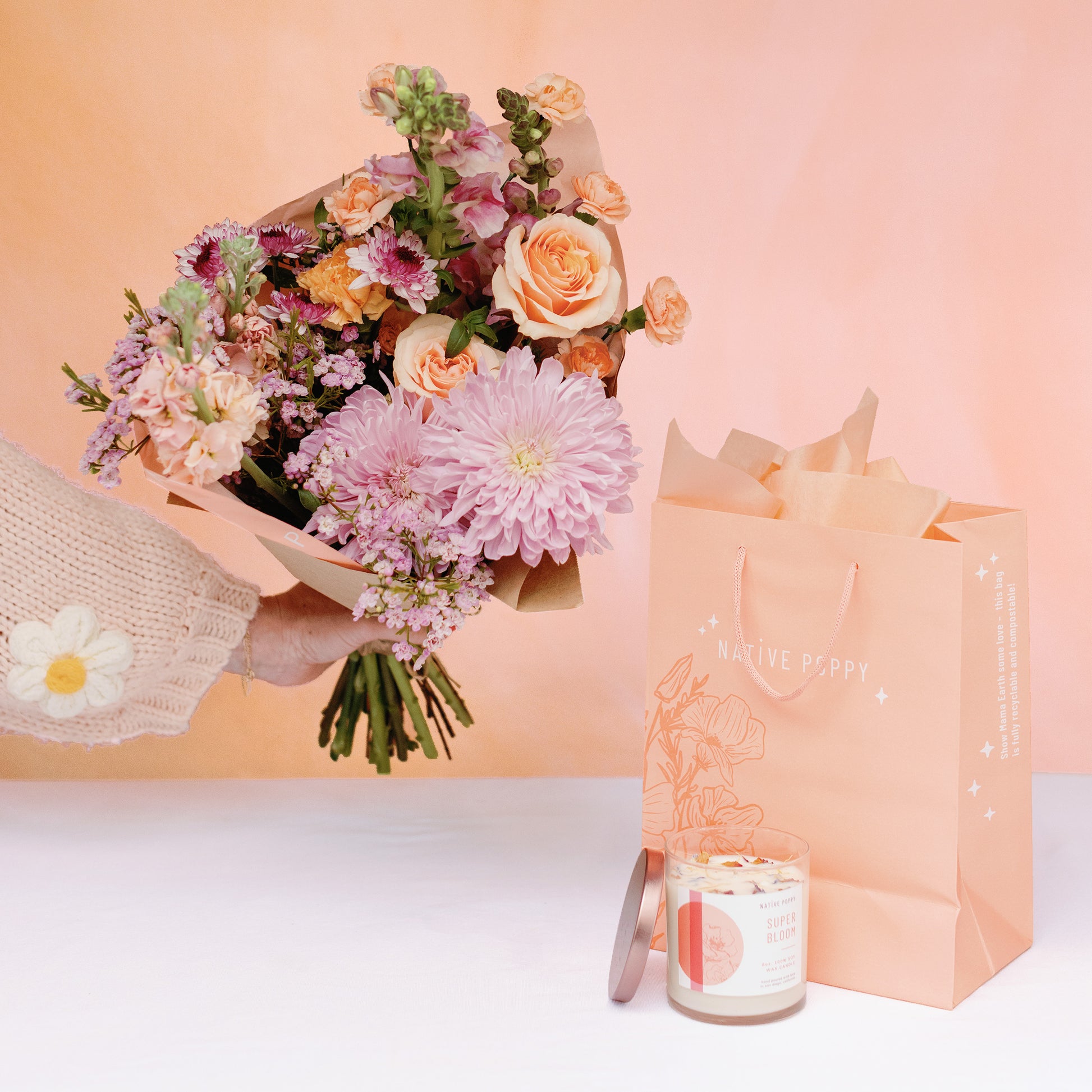 Super Bloom candle and a bouquet of flowers from Native Poppy