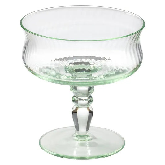 A little vintage charm for your next pour. This mint-hued coupe brings a softly nostalgic feel to the table, with delicate ribbed glass and a sculptural stem that feels collected rather than ordinary.