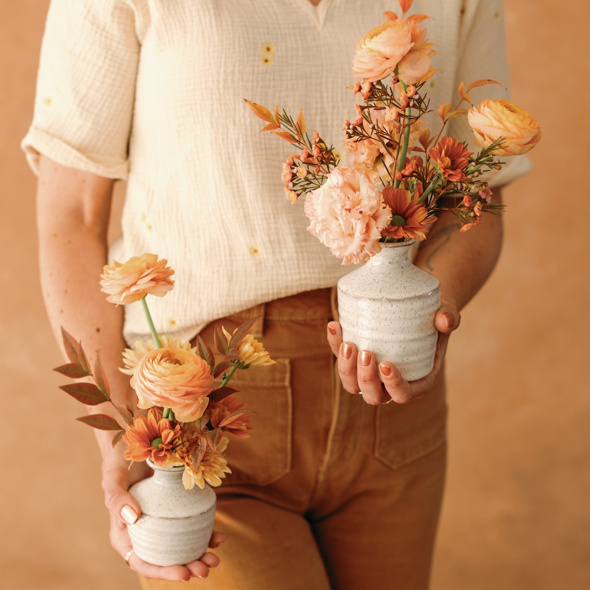 Meg Blancato holds bud vases from Native Poppy
