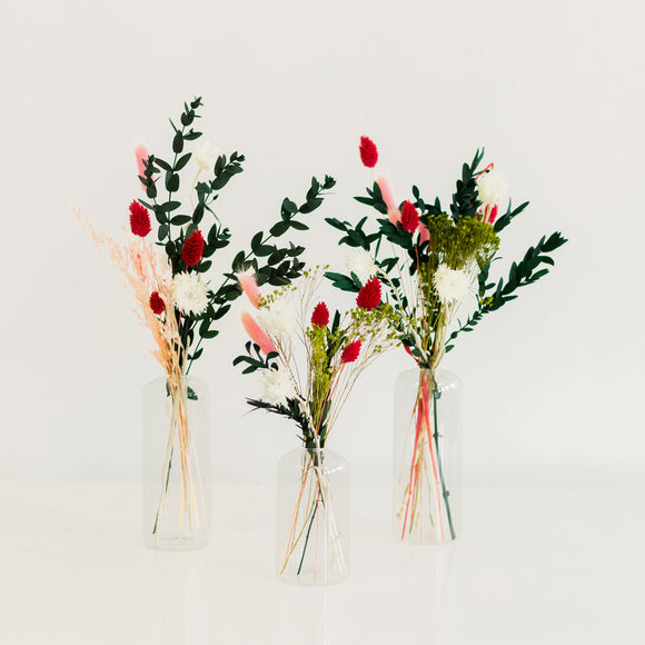 Holiday Bud Vase arrangements with red, green, white, and pink dried flowers