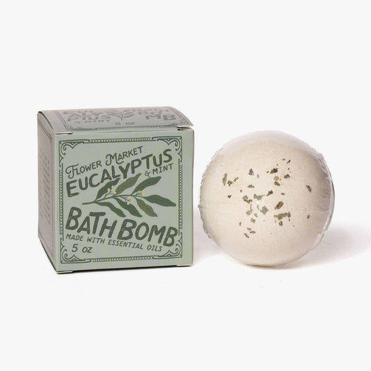 Eucalyptus and mint bath bomb with packaging on a white background