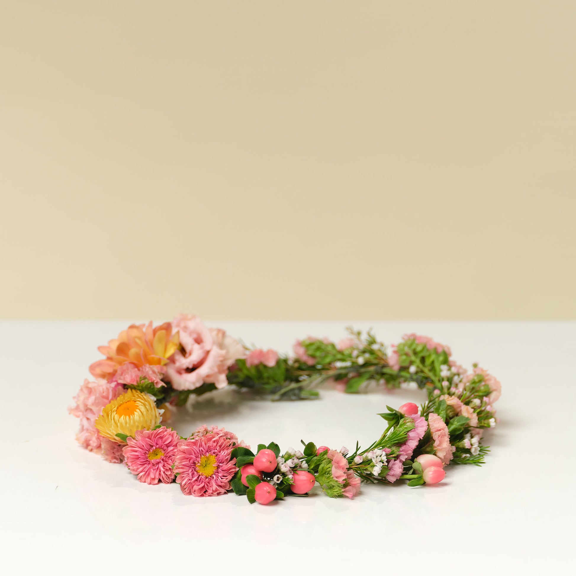 Bright and cheery asymmetrical flower crown from Native Poppy San Diego