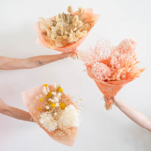 Dried Flowers in three styles wrapped in peach paper