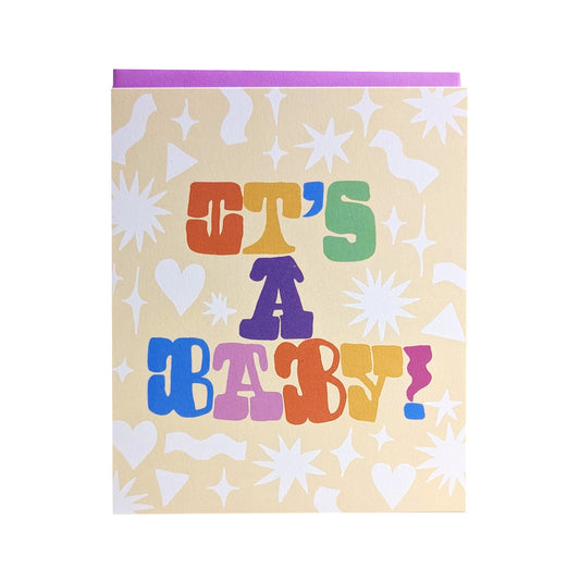Greeting card with 'It's a Baby!' text in colorful letters on a patterned background