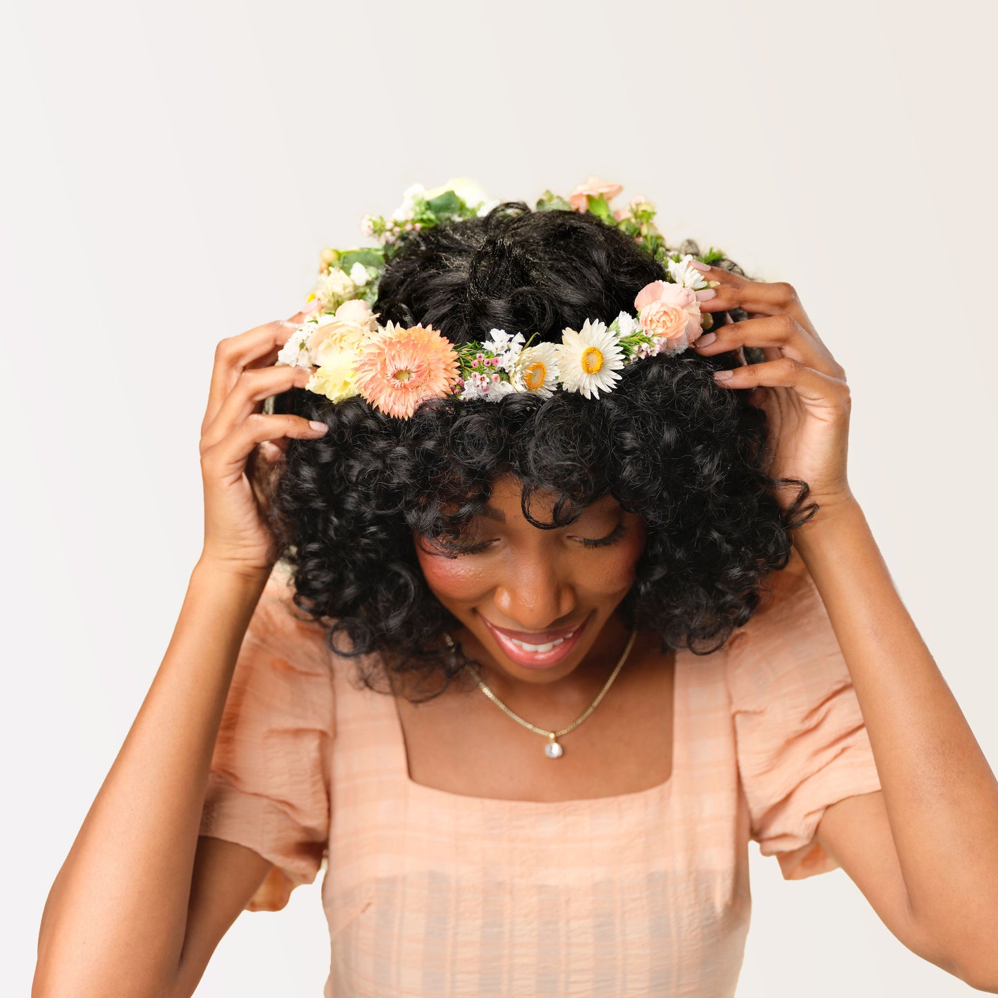 Lucy Flower crown in neutral colors worn by a model