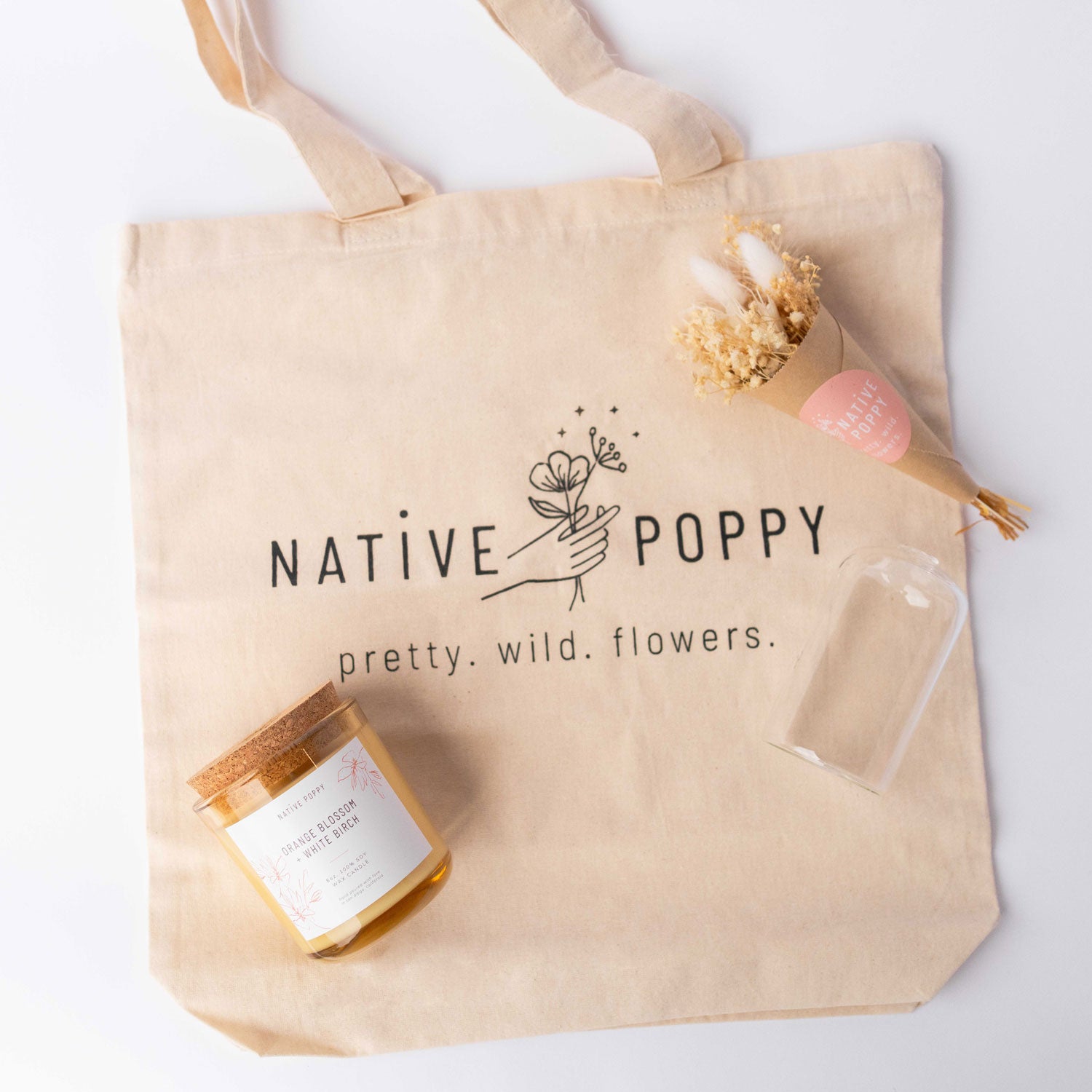 Contents of Native Poppy Signature Gift Box - tote bag, candle, dried flowers, and vase