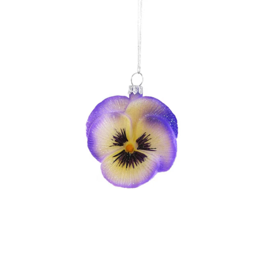 Decorative purple and yellow flower ornament on a white background