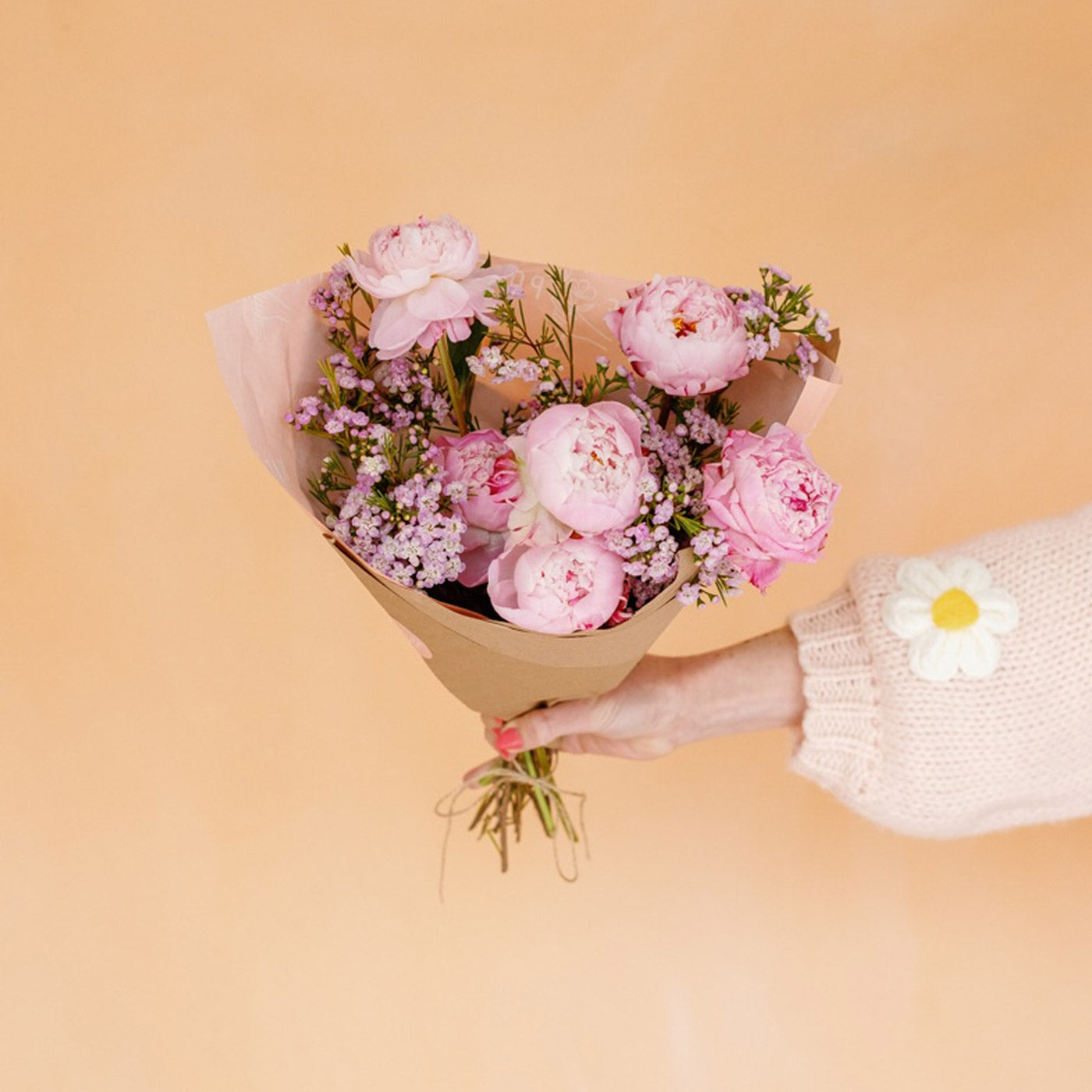 Multicolored peonies wrapped in paper for Mother's Day