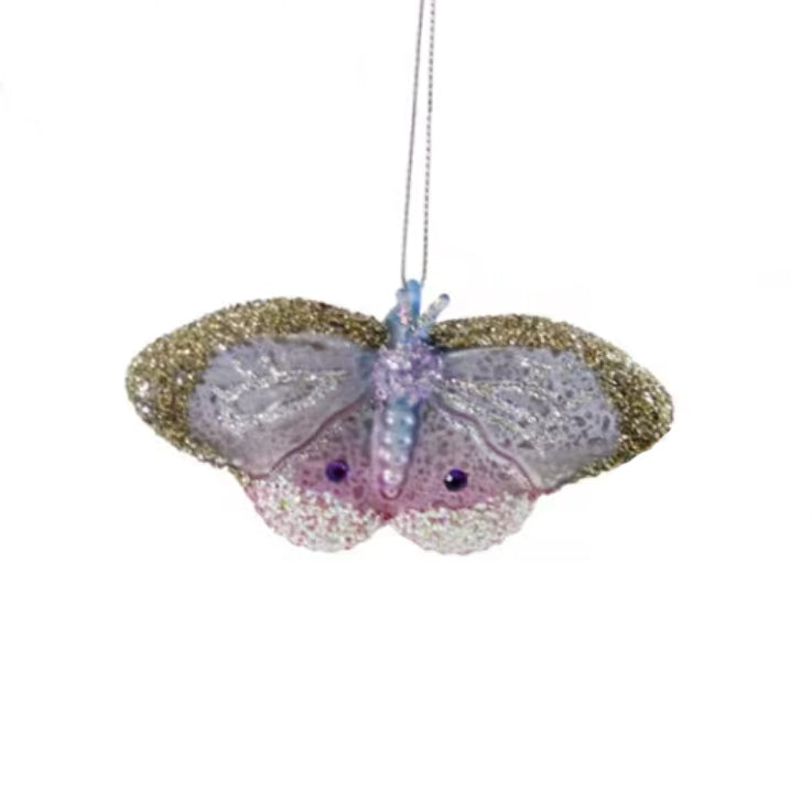 Decorative butterfly ornament with glittery wings on a white background