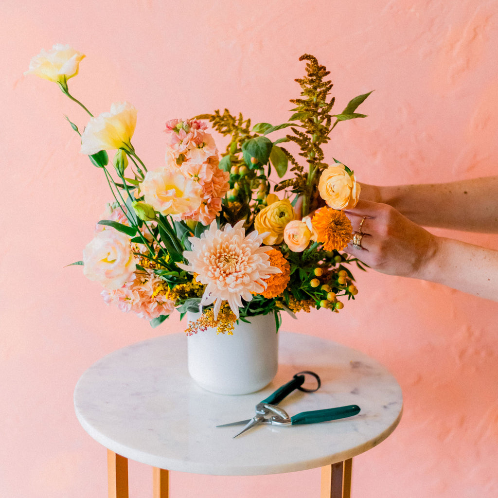 Florist demos creating a thanksgiving centerpiece
