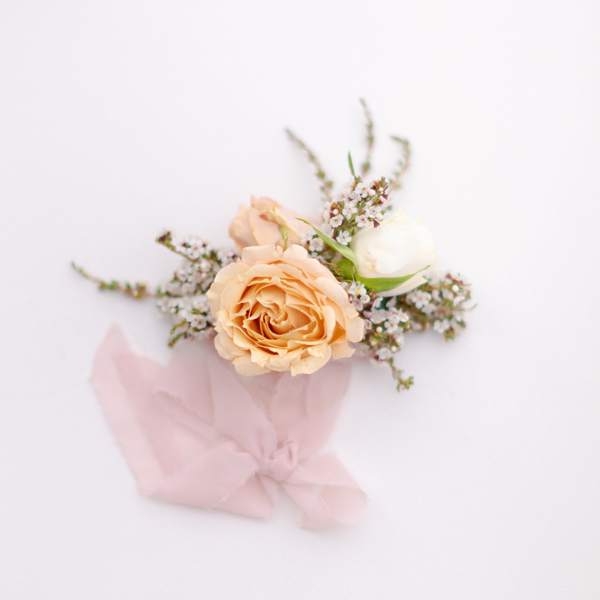 Floral wrist corsage with chiffon ribbon
