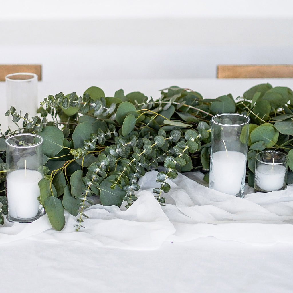 Eucalyptus Greenery Garland on a table with votive candles