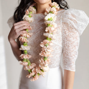 Elegant + Neutral flower necklace worn by a bride