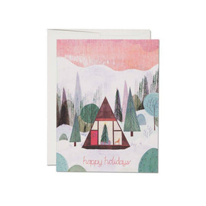 Modern Cabin holiday card with pink sky and multicolored trees 