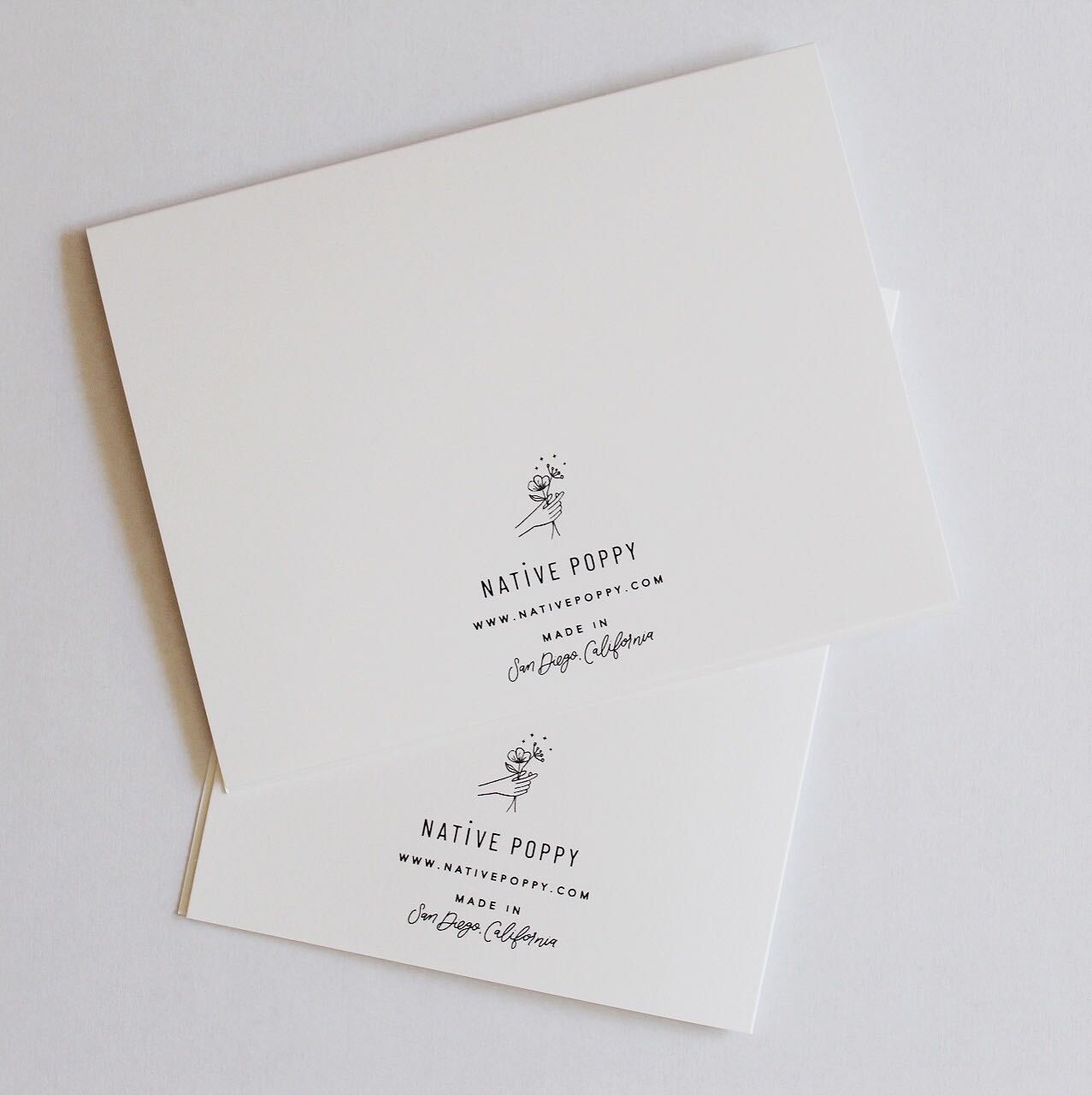 Back of card with Native Poppy logo