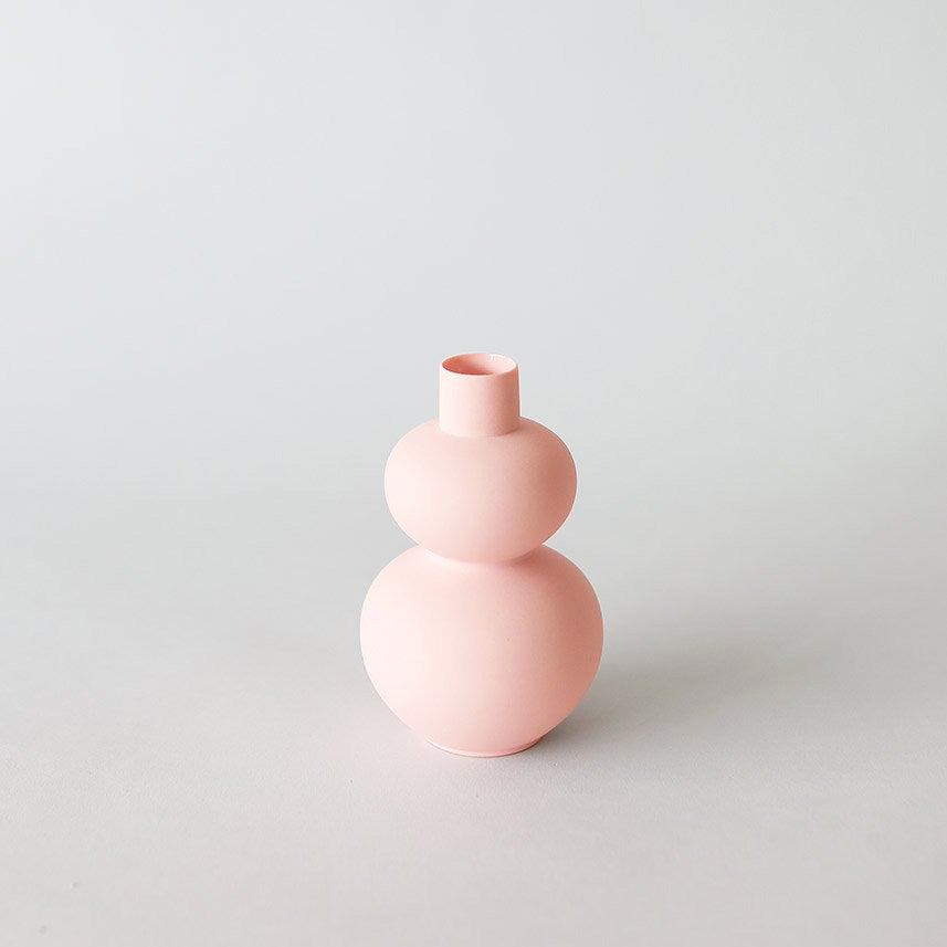 Pink bud vase with curvy double orb form