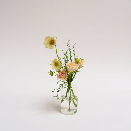 Small glass bud vase flower arrangement