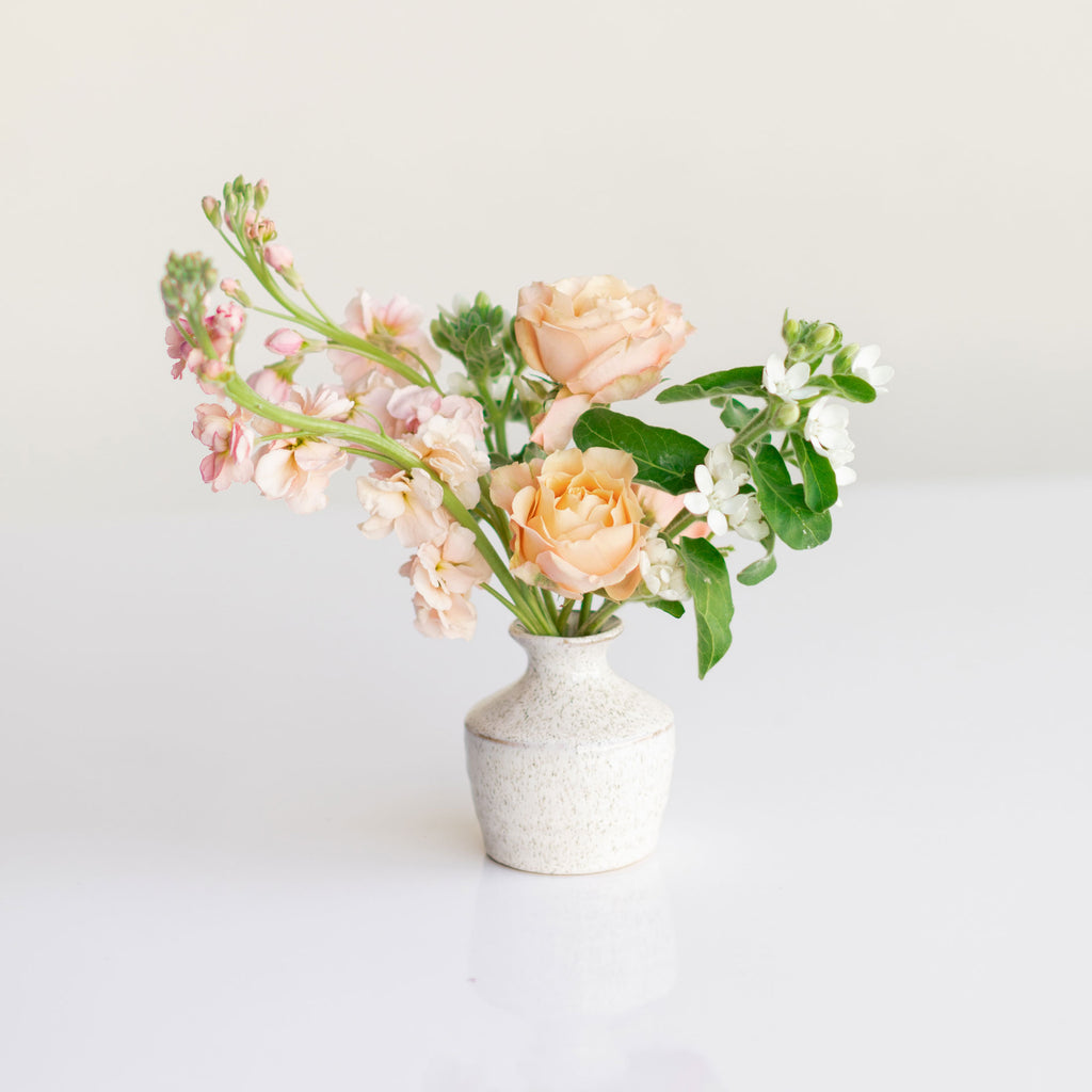 Small ceramic bud vase flower arrangement