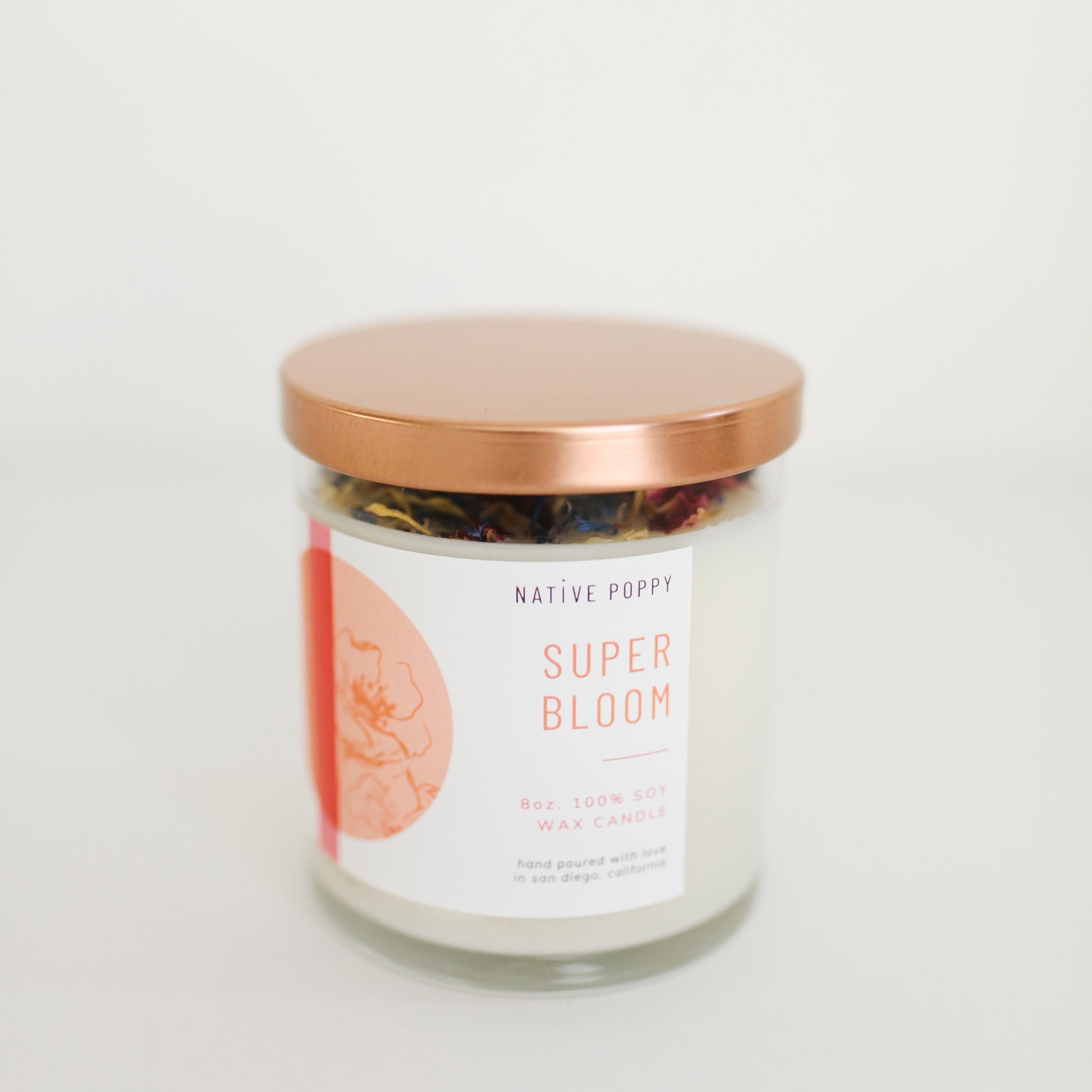 Superbloom candle from Native Poppy in a glass jar with brass lid