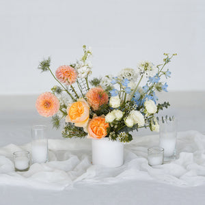 Sympathy Floral Centerpiece in shades of pastel with votive candles