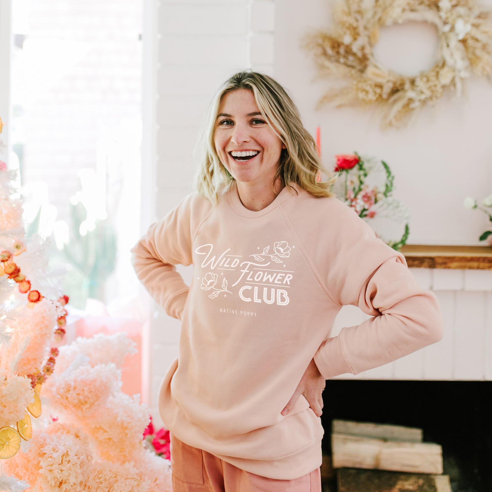 Native Poppy founder wears Peach Wild Flower Club Sweatshirt