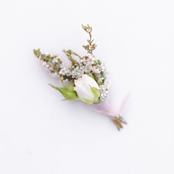 Petite white boutonniere from Native Poppy in San Diego