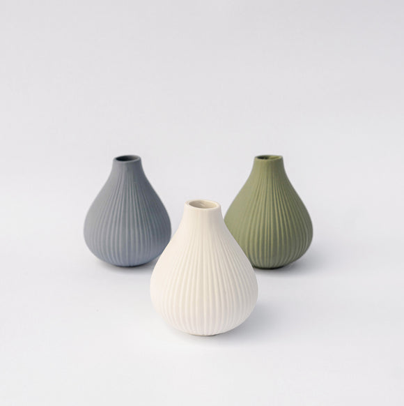 Pastel ceramic bud vases with carved texture