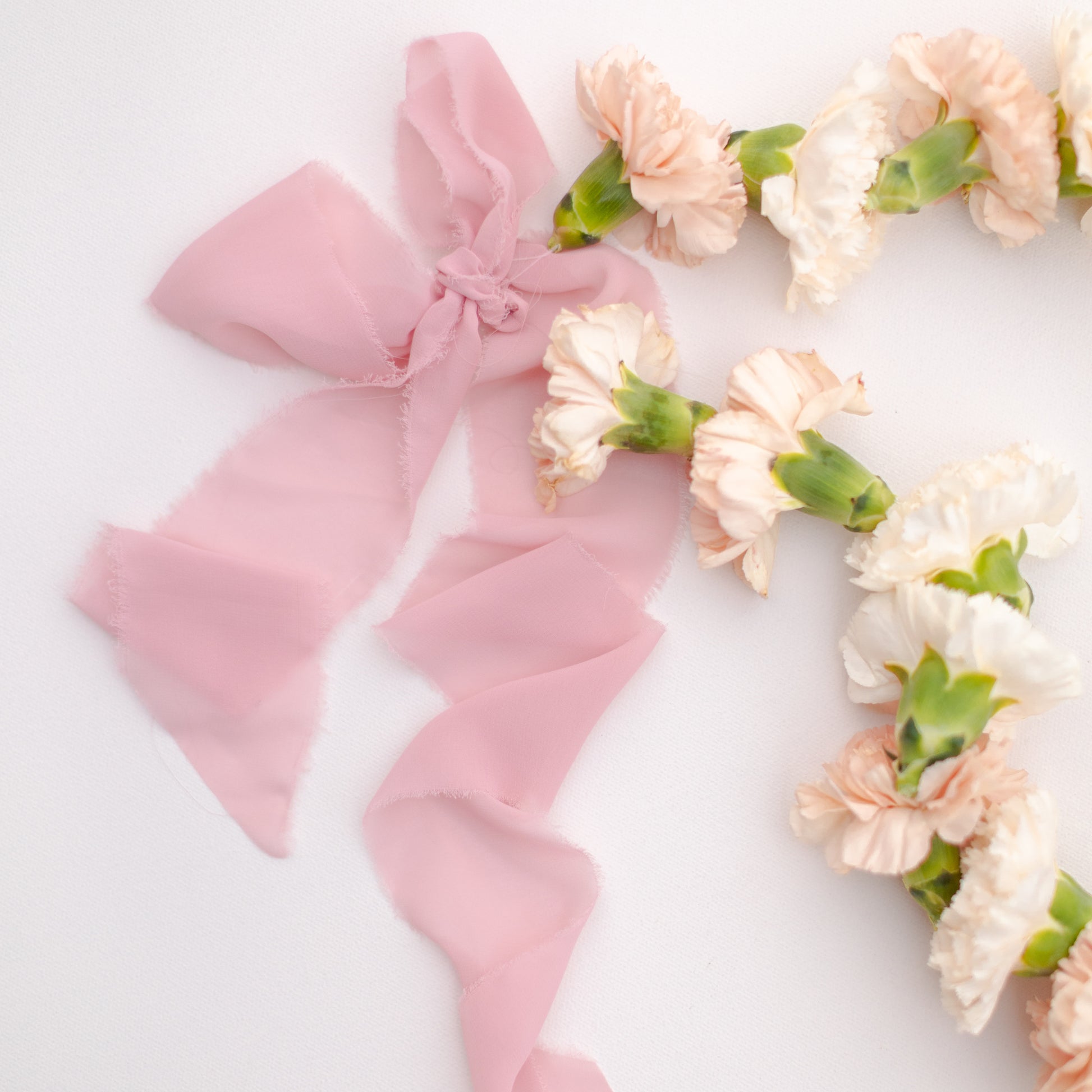 Chiffon ribbon tie detail on flower necklace
