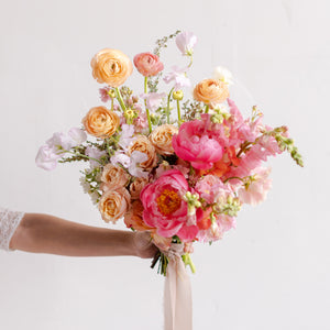 Bridal bouquet with peonies, ranunculus, and roses from Native Poppy