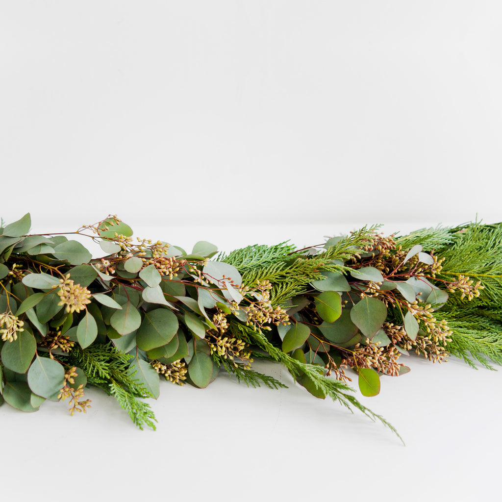 Holiday garland with seeded eucalyptus and evergreen clippings