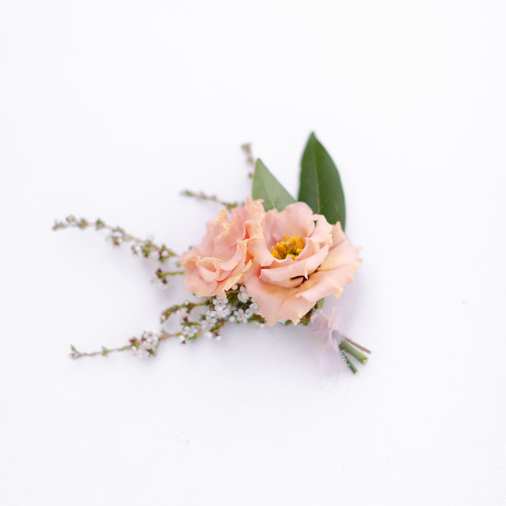 Peach floral boutonniere from Native Poppy in San Diego
