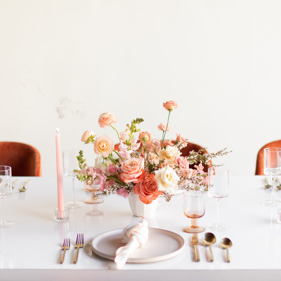 Petite centerpiece flower arrangement on a formal table