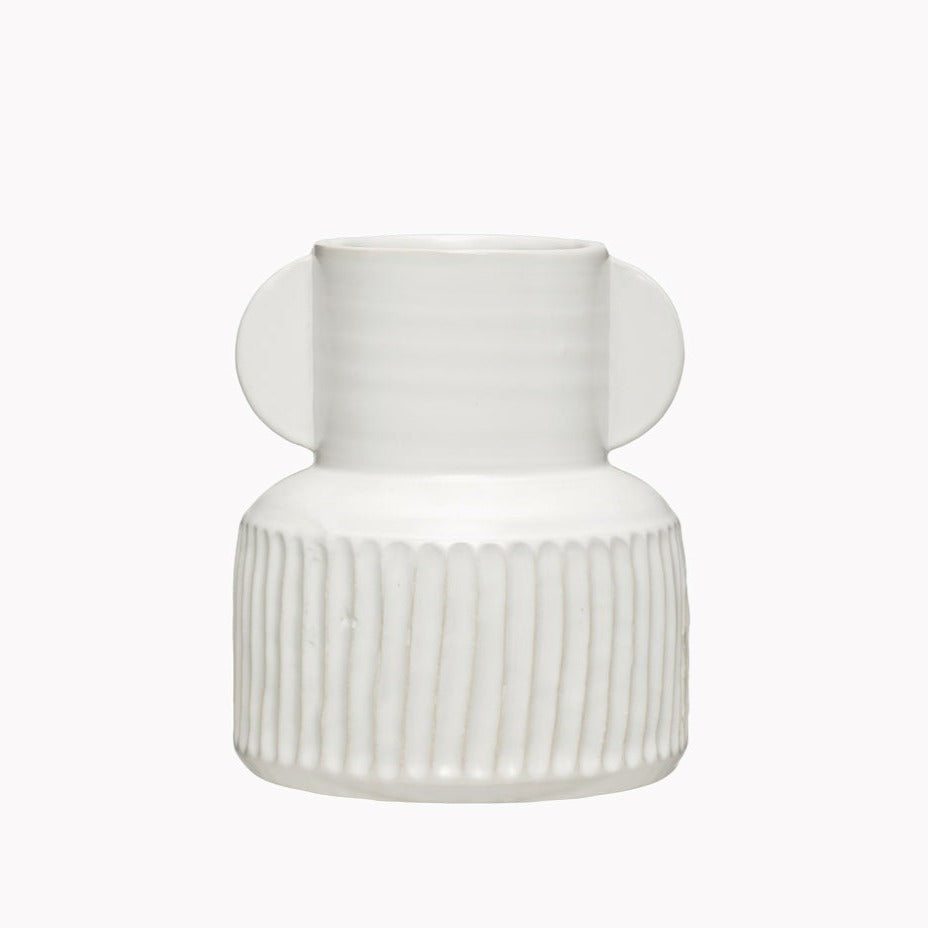 White ceramic vase with vertical striped carving