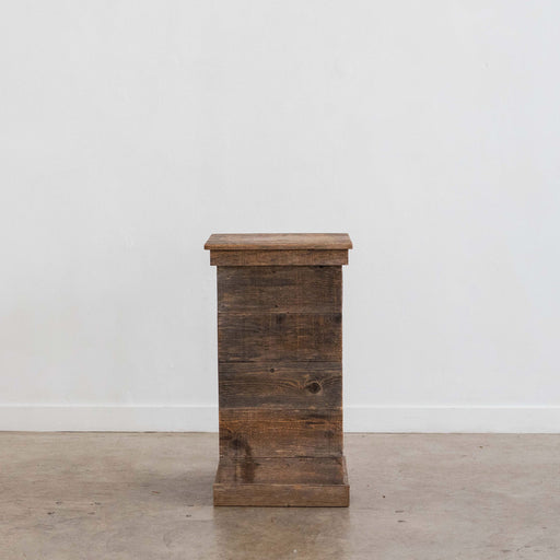 short wooden pedestal for events or display