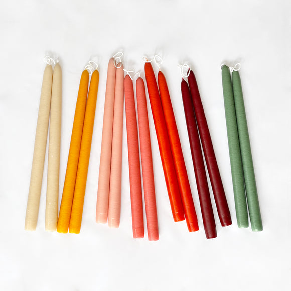 Seven pairs of colorful taper candles