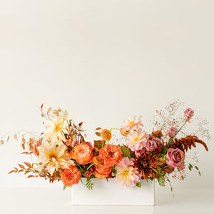Thanksgiving Long & Low Arrangement with ivory, gold, peach, rust, and pink blooms